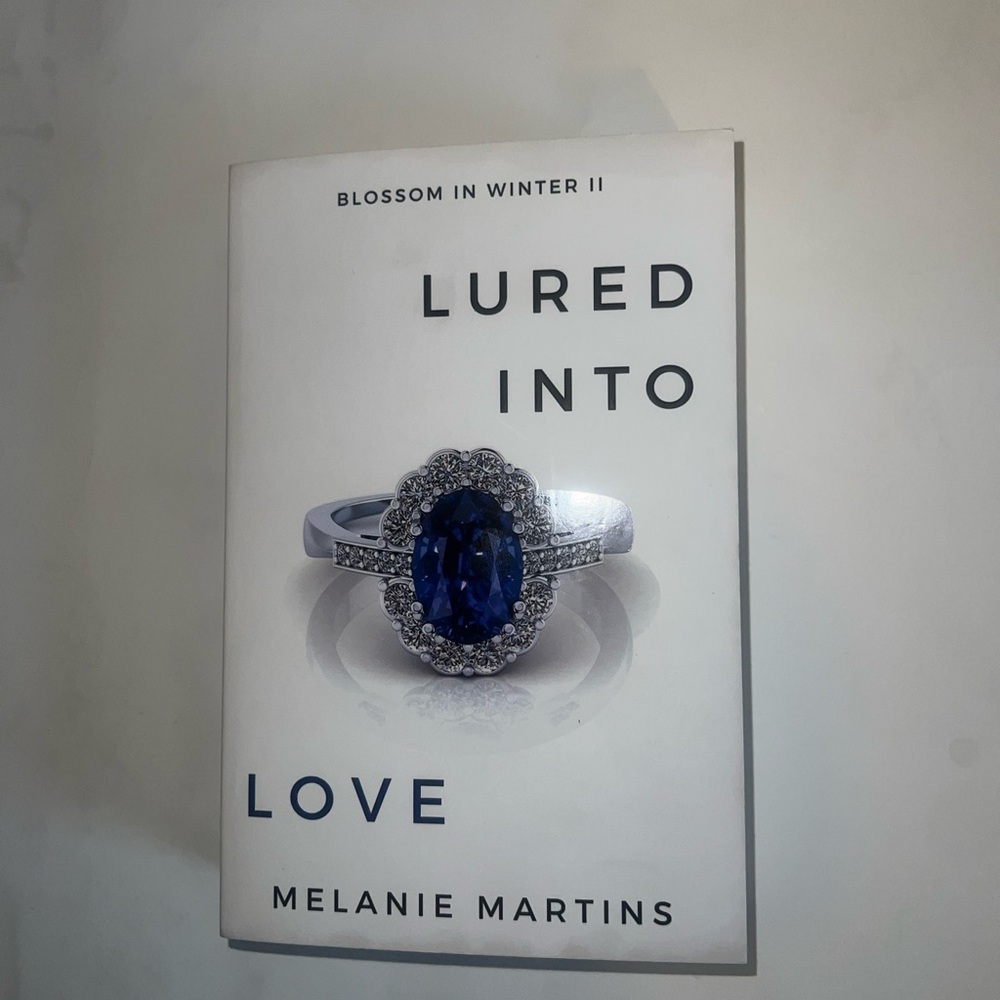 Lured into love by Melanie Martins book